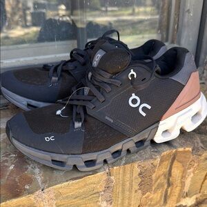 On Running Black and Gray Athletic Shoes with CloudTec Cushioning